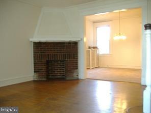 203 Kingston Road Upper Darby, PA 19082 - Photo 4 of 7 Living room with corner fireplace
