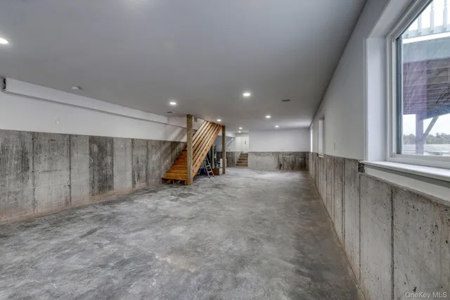 a view of a hall with stairs