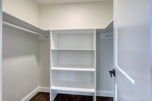 a view of a house with snow on the road