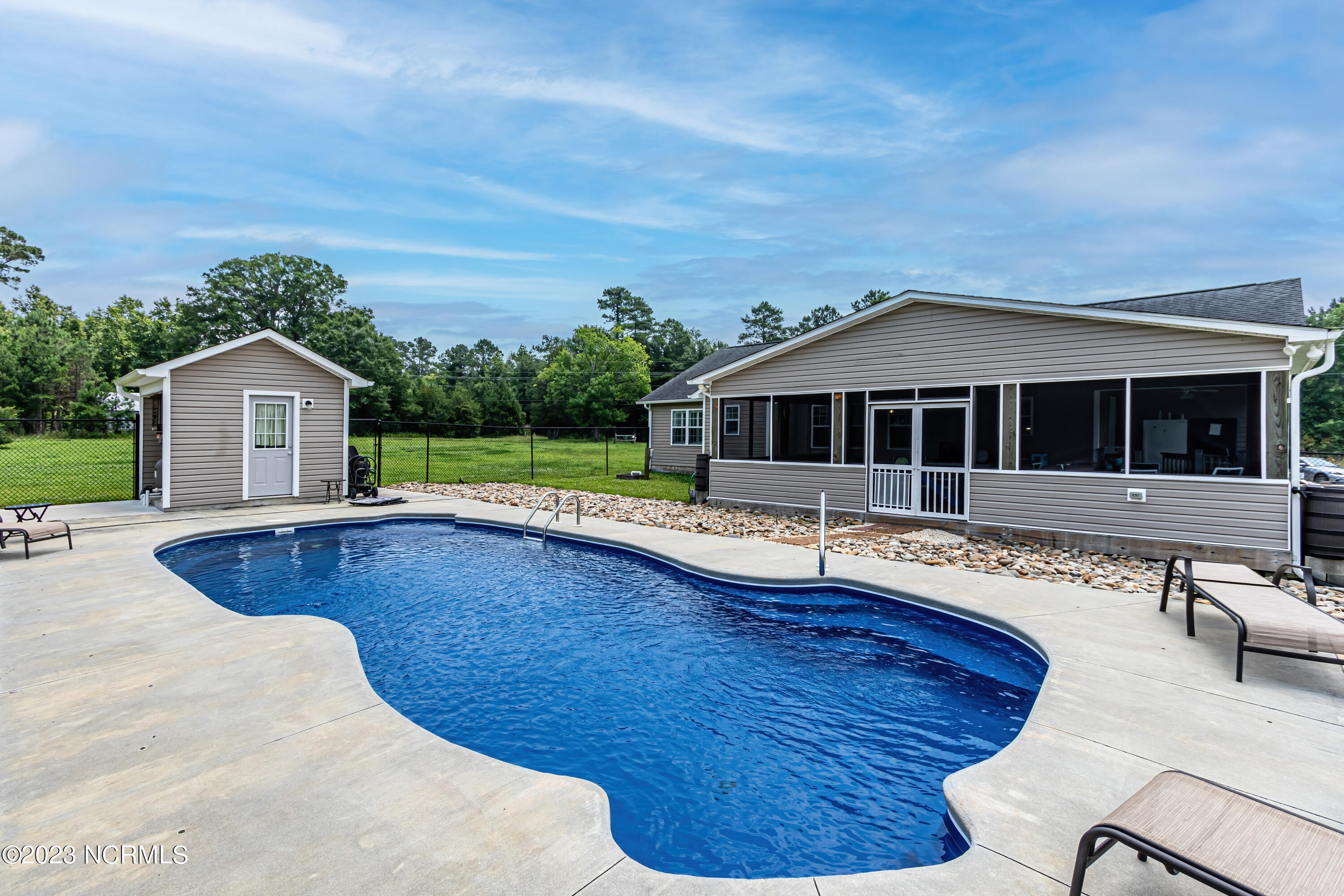 1428 Haws Run Road Maple Hill, NC 28454 - Photo 38 of 55 Backyard with pool