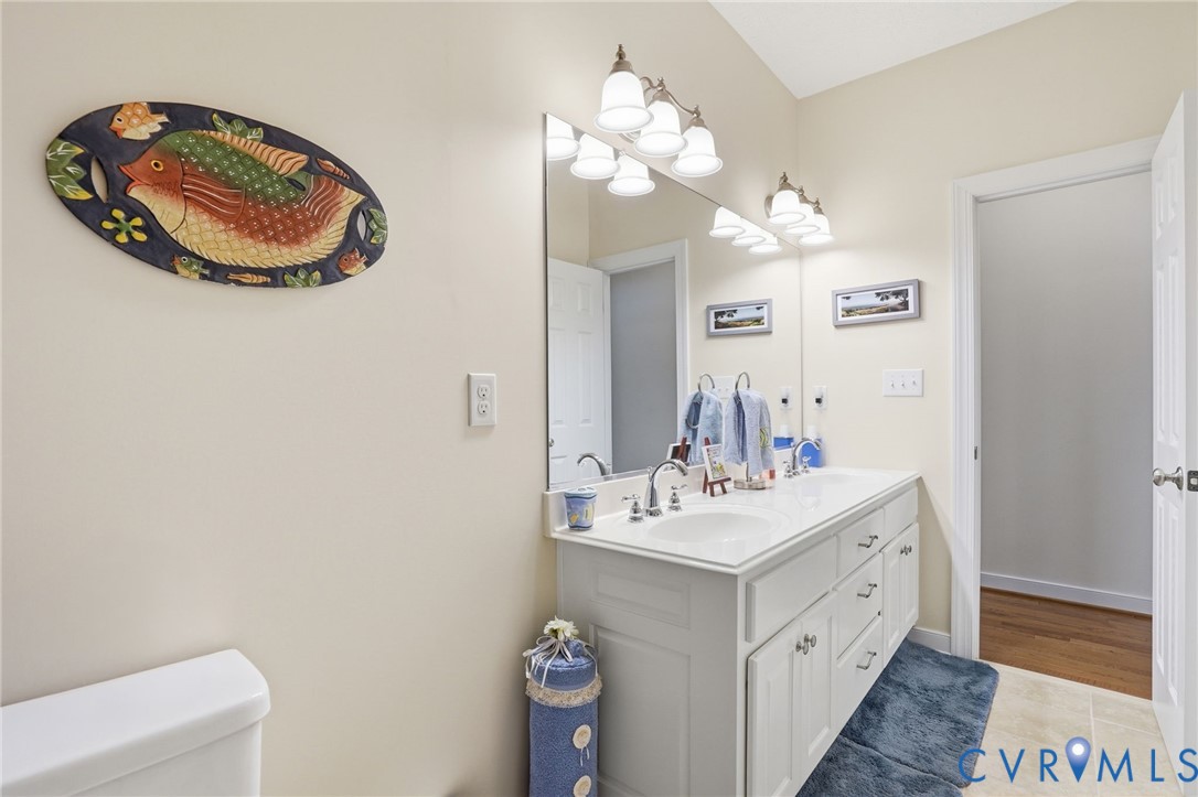 3600 Market Road Mechanicsville, VA 23111 - Photo 37 of 67 a bathroom with a sink mirror and vanity