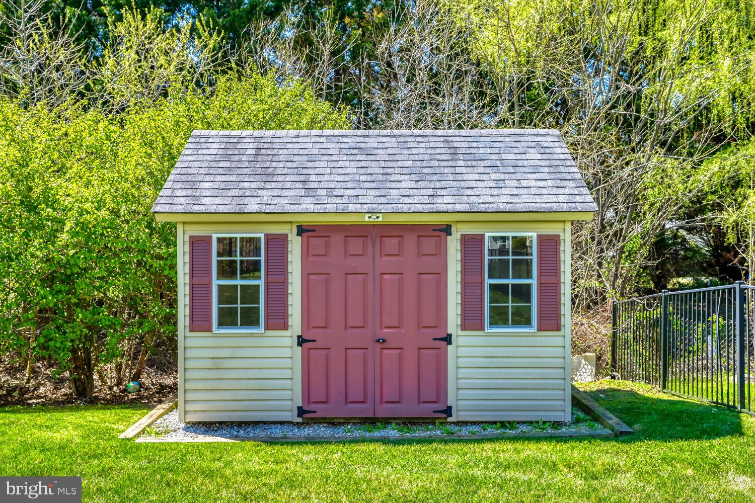 4216 Cross Spring Drive Nottingham, MD 21236 - Photo 11 of 21 Charming garden shed with vibrant doors.