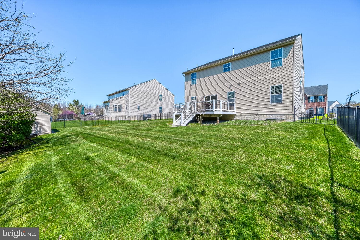 4216 Cross Spring Drive Nottingham, MD 21236 - Photo 13 of 21 Spacious backyard with lush greenery.