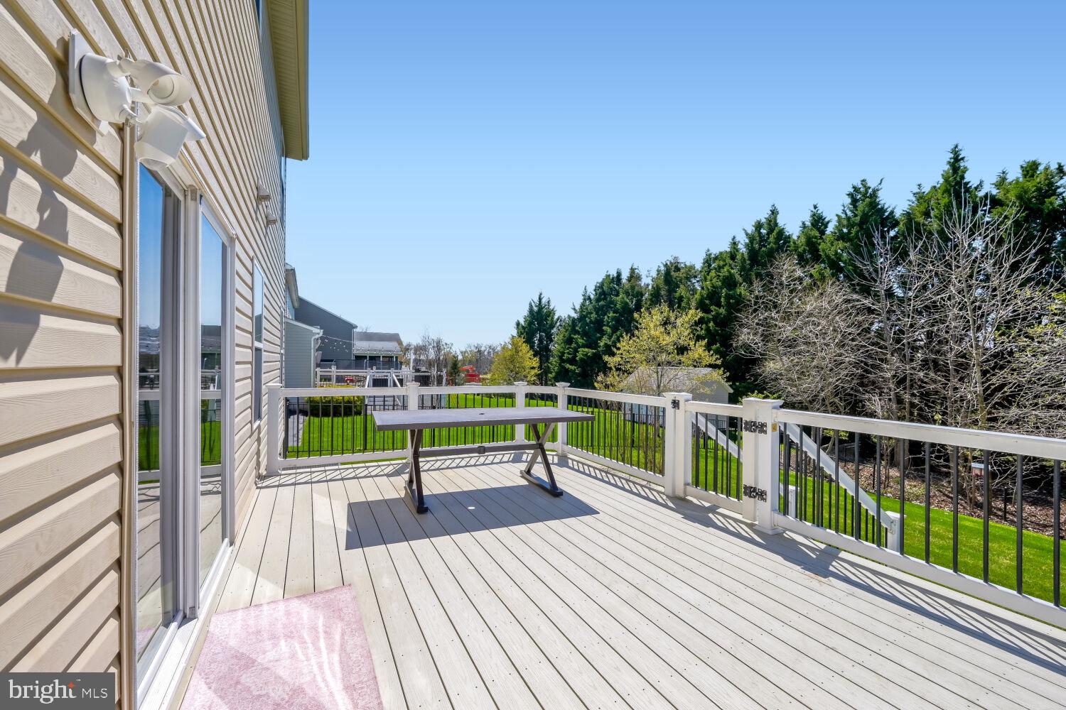 4216 Cross Spring Drive Nottingham, MD 21236 - Photo 19 of 47 a view of a deck with two chairs and a potted plant