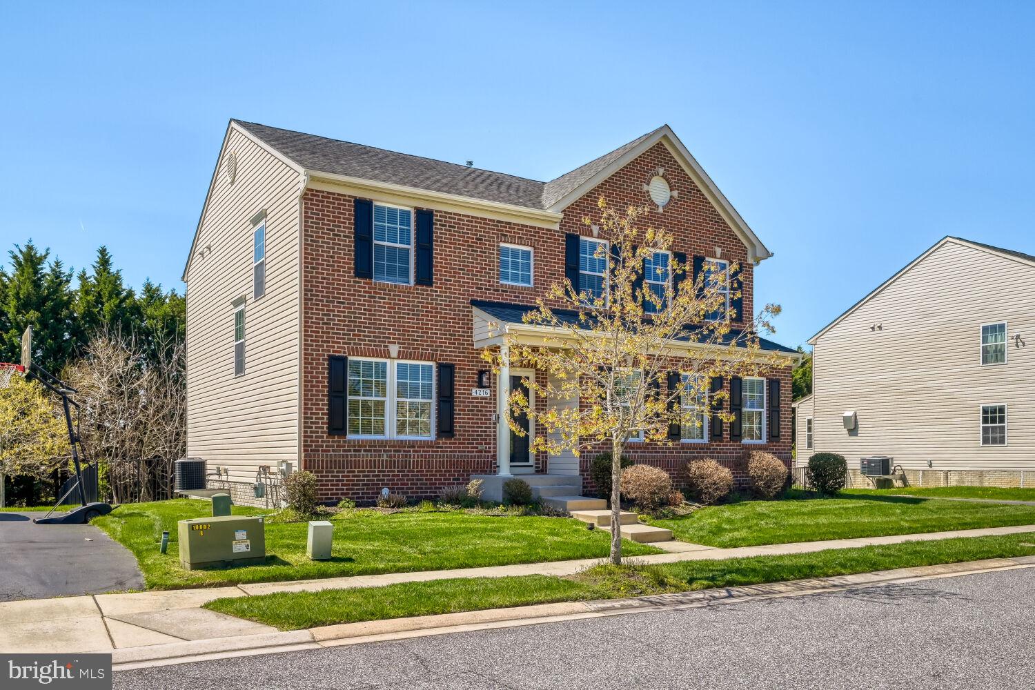 4216 Cross Spring Drive Nottingham, MD 21236 - Photo 2 of 21 Charming brick home with lush greenery.