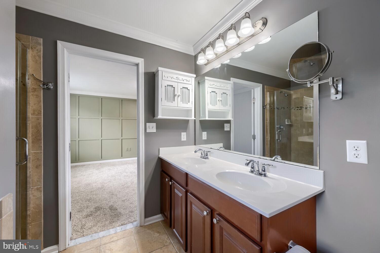 4216 Cross Spring Drive Nottingham, MD 21236 - Photo 26 of 47 a bathroom with a sink a mirror and a shower