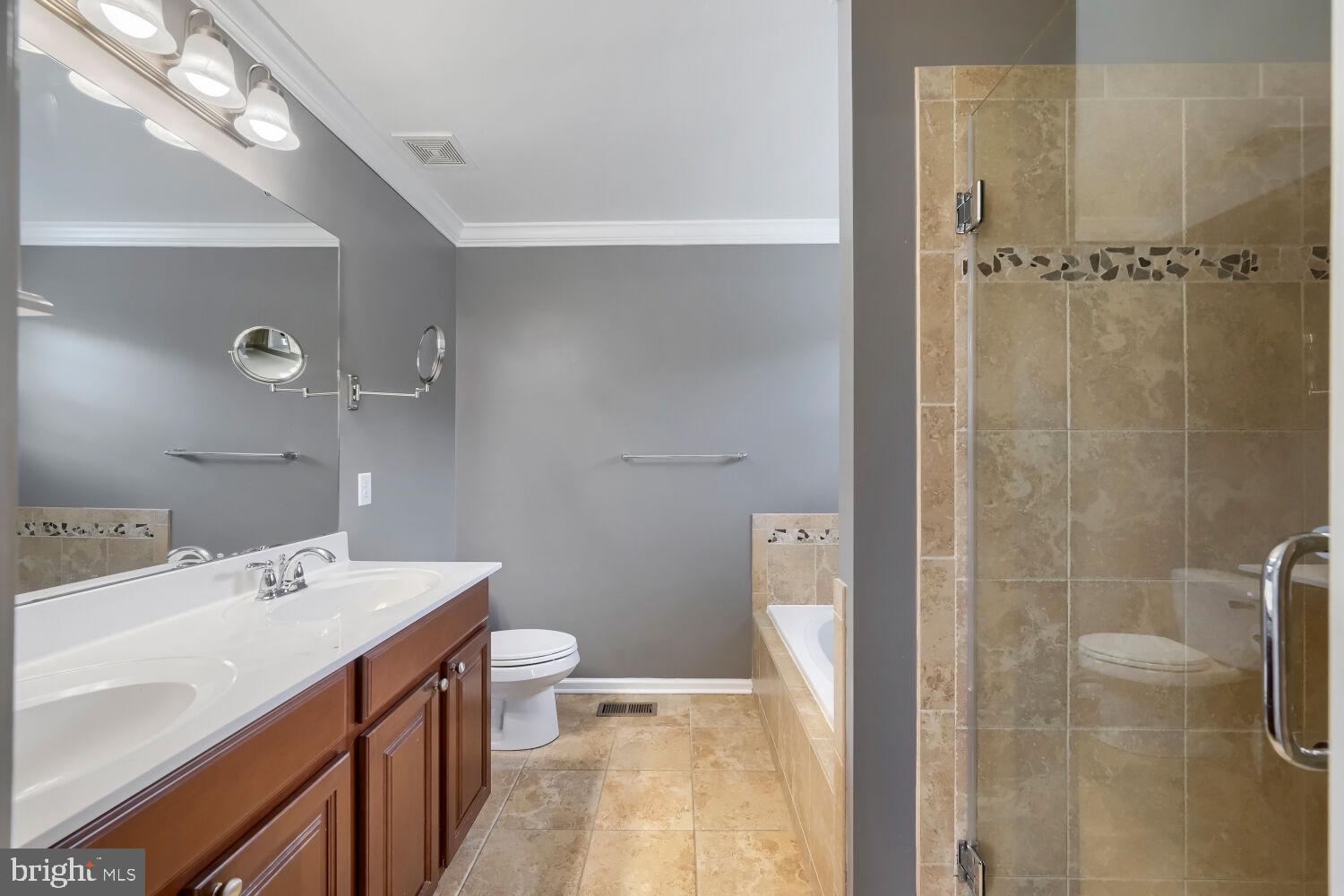 4216 Cross Spring Drive Nottingham, MD 21236 - Photo 27 of 47 a bathroom with a sink a toilet and shower