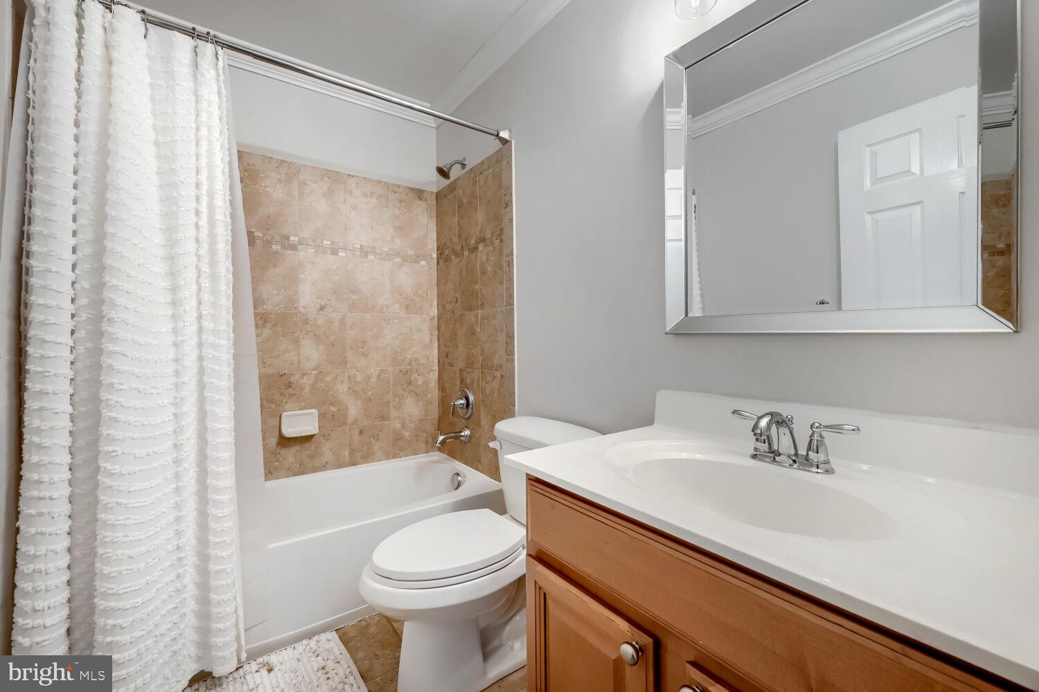 4216 Cross Spring Drive Nottingham, MD 21236 - Photo 30 of 47 a bathroom with a sink a toilet and shower