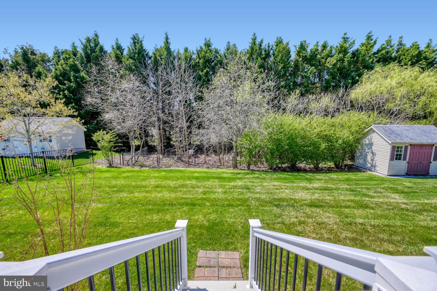 4216 Cross Spring Drive Nottingham, MD 21236 - Photo 37 of 47 a view of a wooden deck and a garden