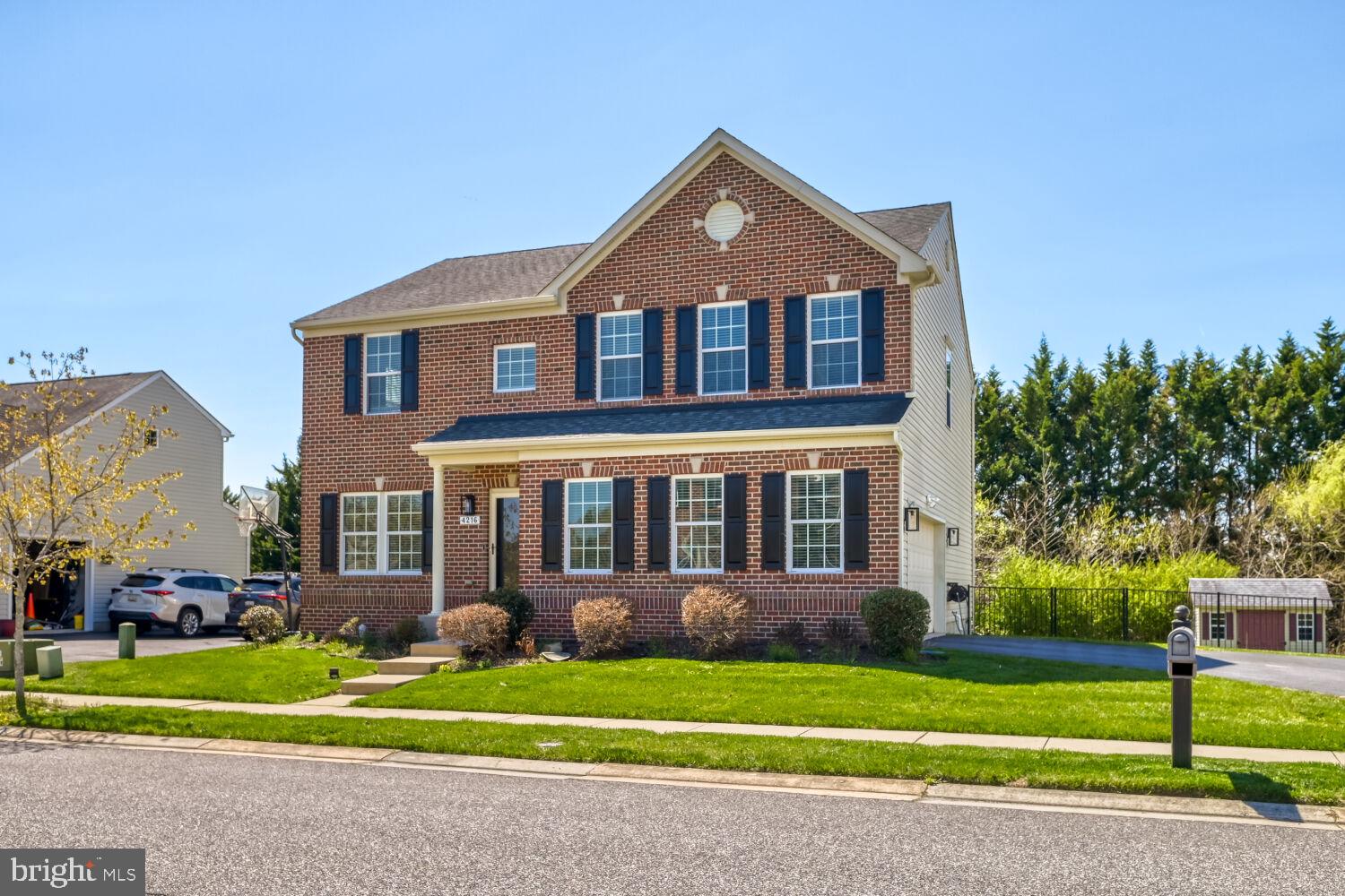 4216 Cross Spring Drive Nottingham, MD 21236 - Photo 5 of 21 Charming brick home with lush greenery.