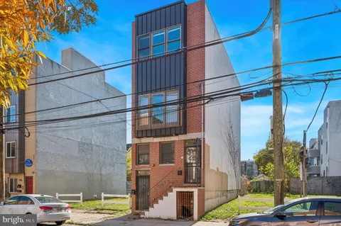 a view of a street with cars