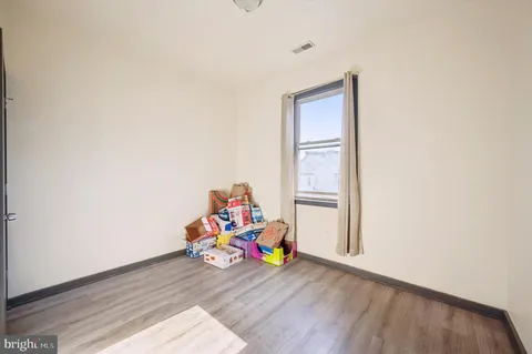 a room with toys and wooden floor