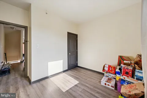 a bathroom with a granite countertop toilet sink and a mirror