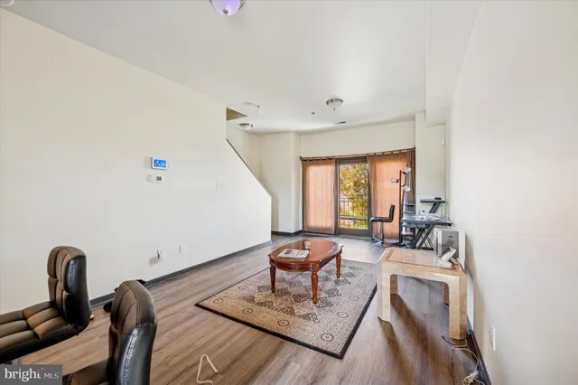 a living room with furniture and a rug