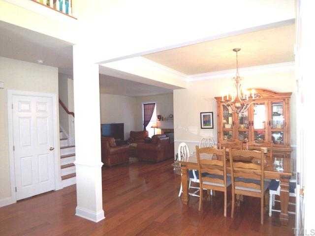 9504 Dellbrook Court Raleigh, NC 27617 - Photo 11 of 12 Greet guests in your End Unit Townhome with two story soaring ceiling and open & spacious floor plan.