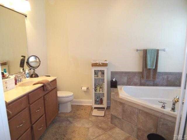9504 Dellbrook Court Raleigh, NC 27617 - Photo 7 of 12 Master Bath features dual sinks, garden tub and separate shower.