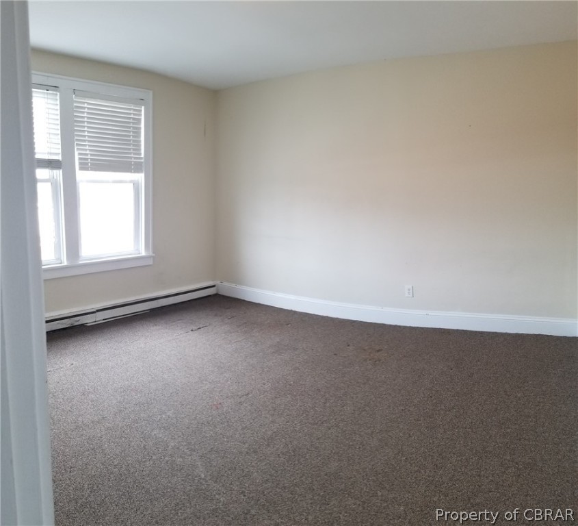 75 South Main Street, Unit 1 Kilmarnock, VA 22482 - Photo 7 of 9 an empty room with a window