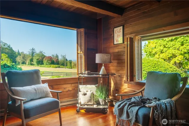 a room with furniture and a large window