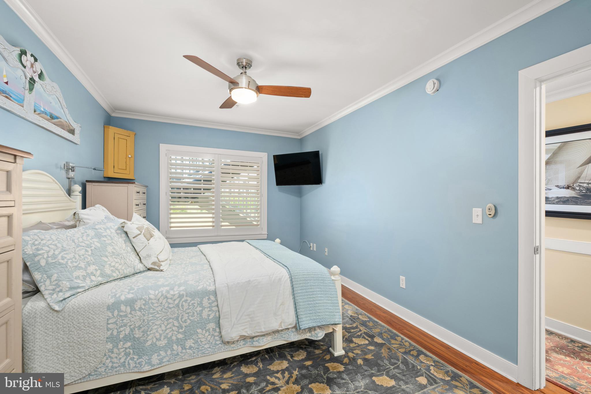 110 Anglers Road, Unit 206 Lewes, DE 19958 - Photo 17 of 40 a bedroom with a bed and window