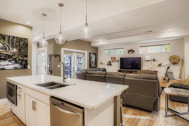 a kitchen with a stove a sink and a refrigerator