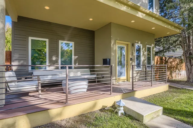 a swimming pool with outdoor seating and yard