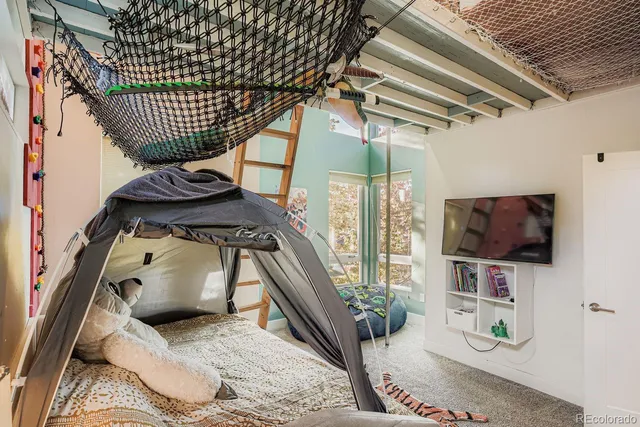 a view of living room with furniture and flat screen tv