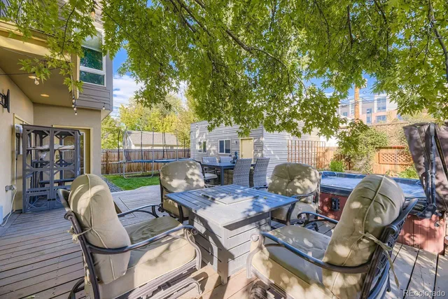 a view of a patio with couches chairs and a fire pit