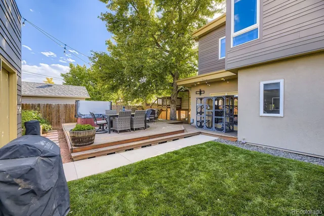 a view of a patio with table and chairs and potted plants