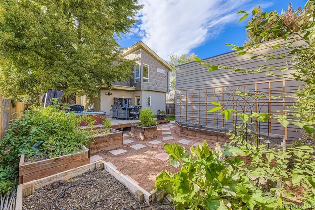 a view of a patio with table and chairs and potted plants