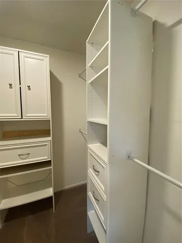 a view of an empty walk in closet
