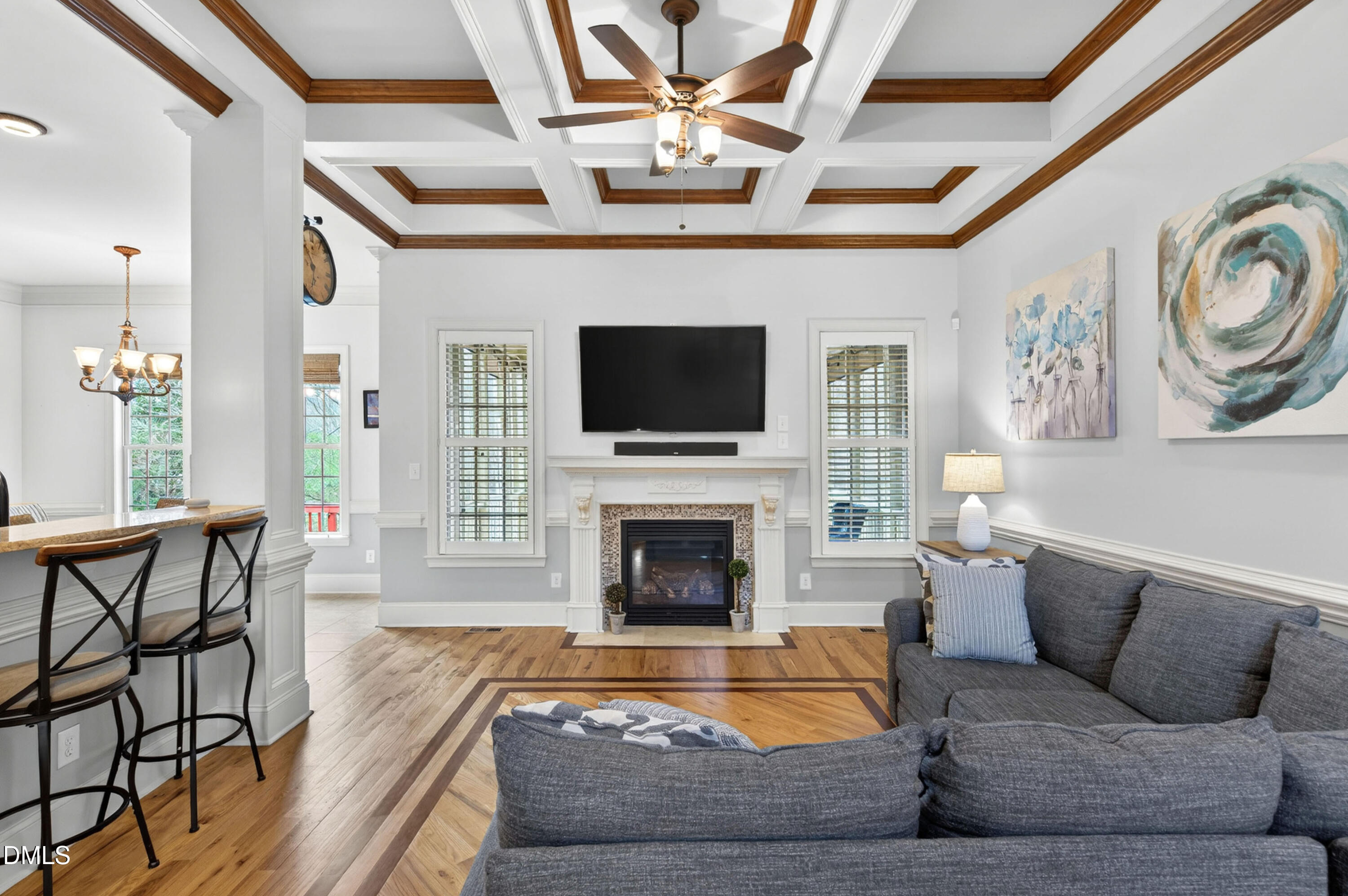 691 Hawthorne Place Creedmoor, NC 27522 - Photo 13 of 84 a living room with furniture a fireplace and a flat screen tv