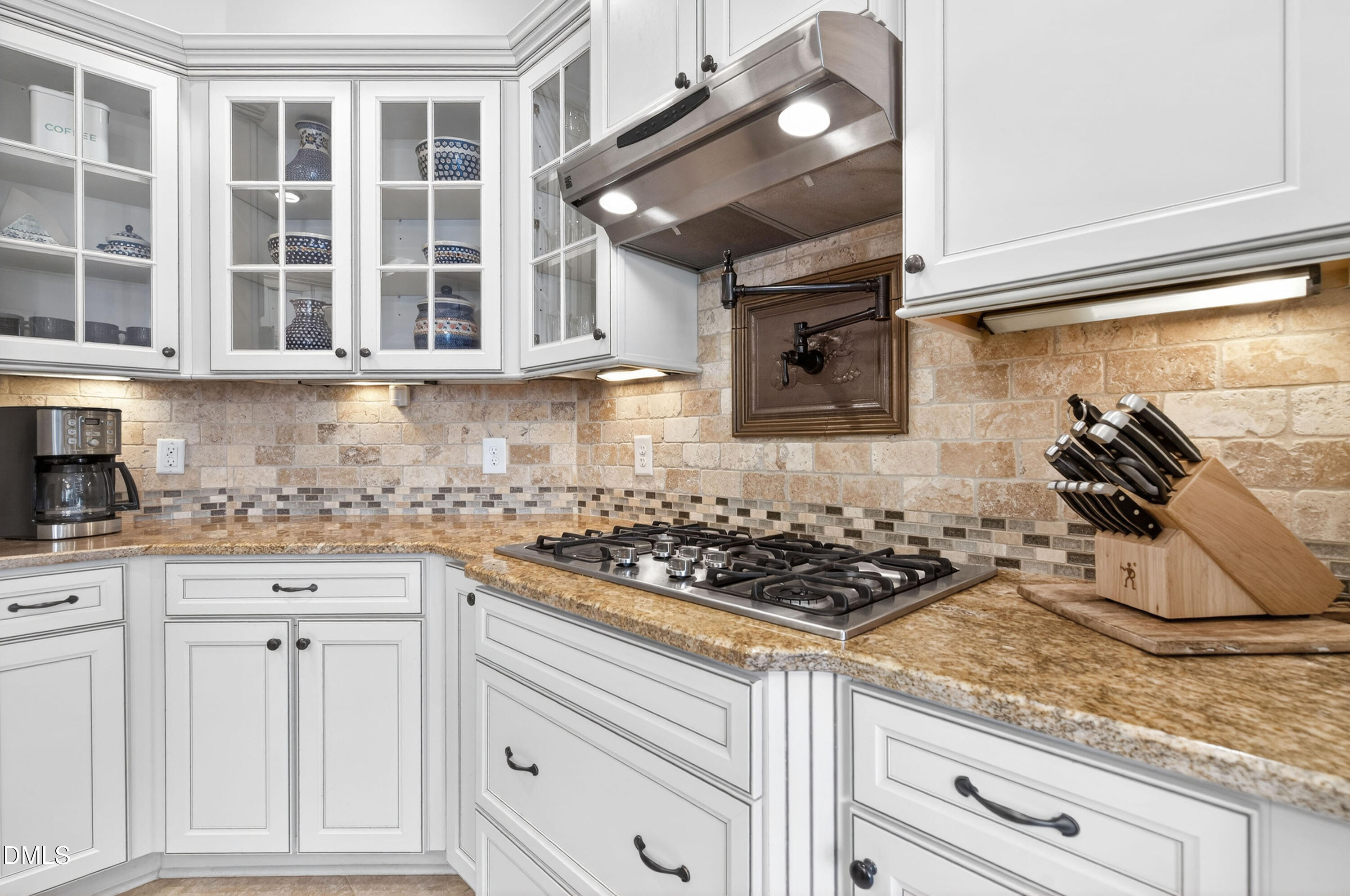 691 Hawthorne Place Creedmoor, NC 27522 - Photo 23 of 84 a kitchen with stainless steel appliances granite countertop a sink and a stove