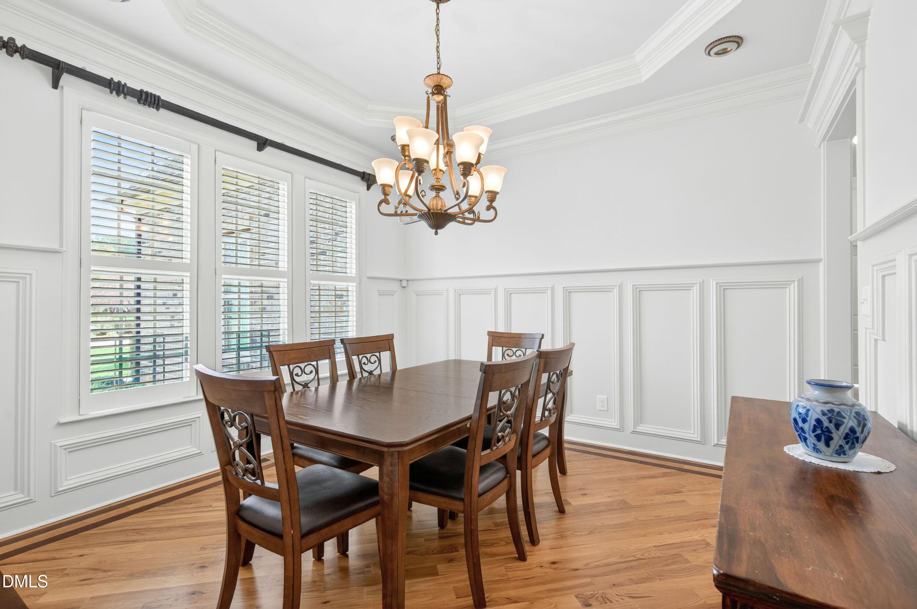 691 Hawthorne Place Creedmoor, NC 27522 - Photo 25 of 84 a view of a dining room with furniture wooden floor and chandelier