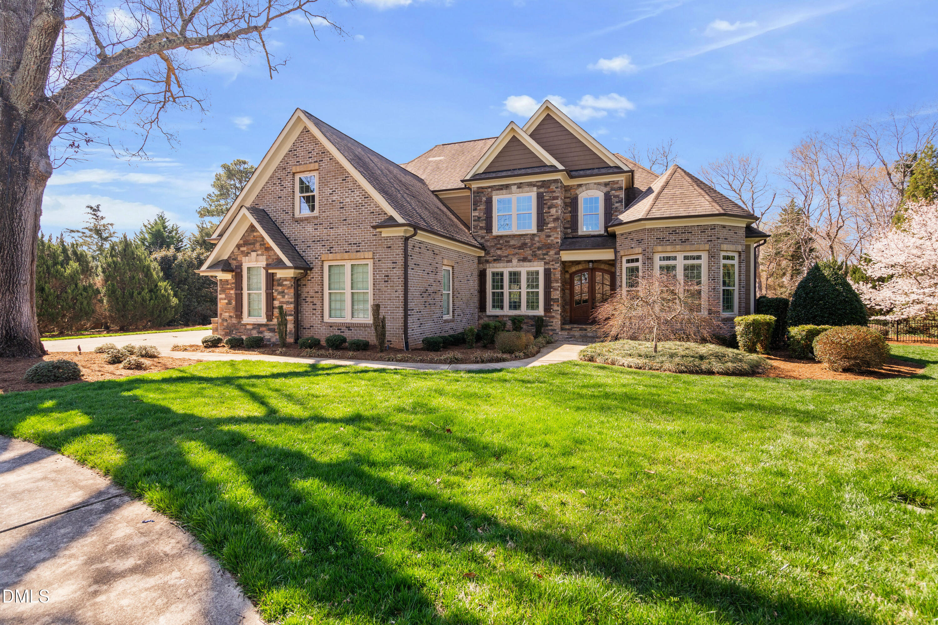 691 Hawthorne Place Creedmoor, NC 27522 - Photo 3 of 84 a front view of a house with a garden and plants