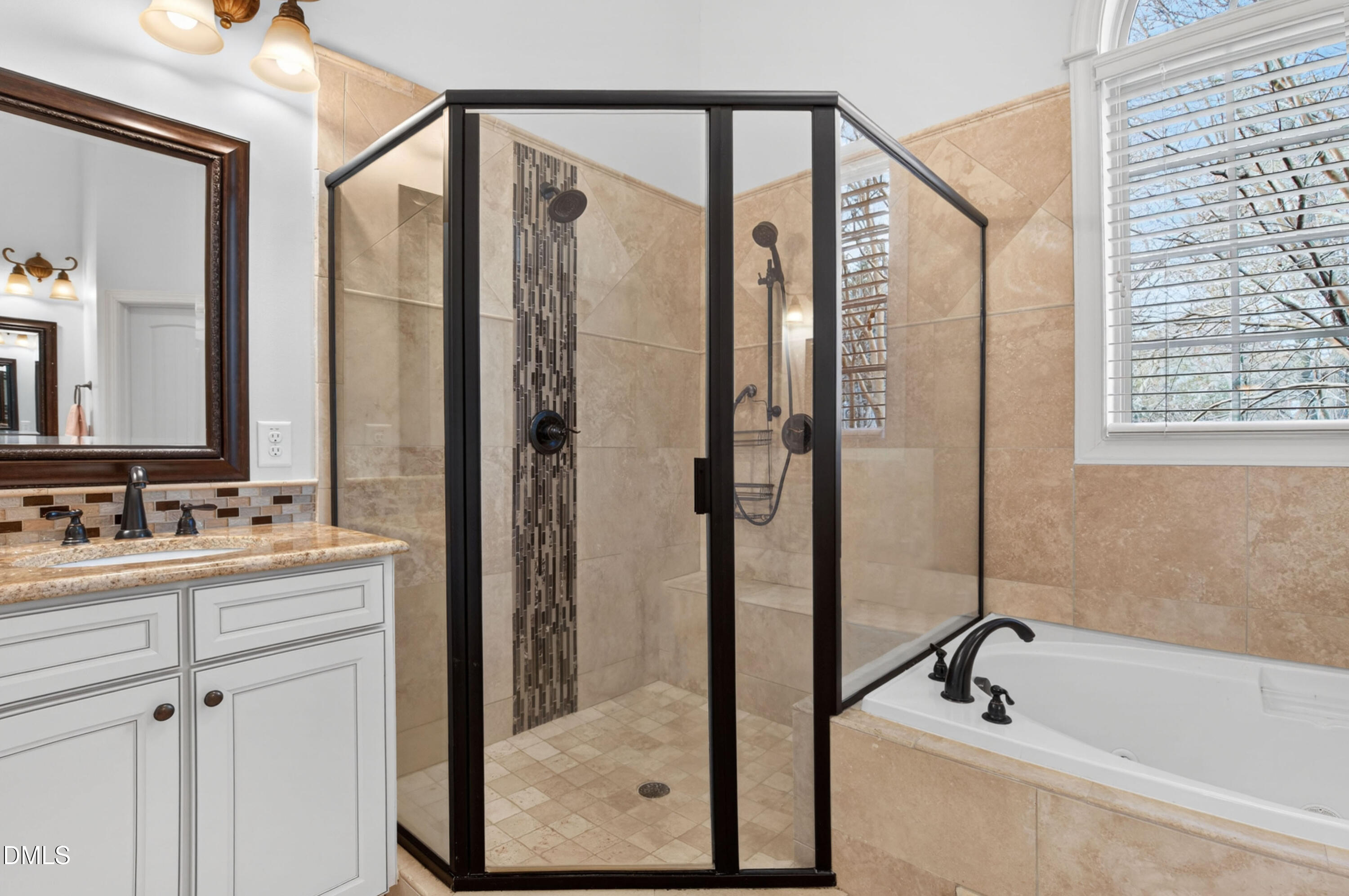 691 Hawthorne Place Creedmoor, NC 27522 - Photo 36 of 84 a bathroom with a tub a sink and a mirror