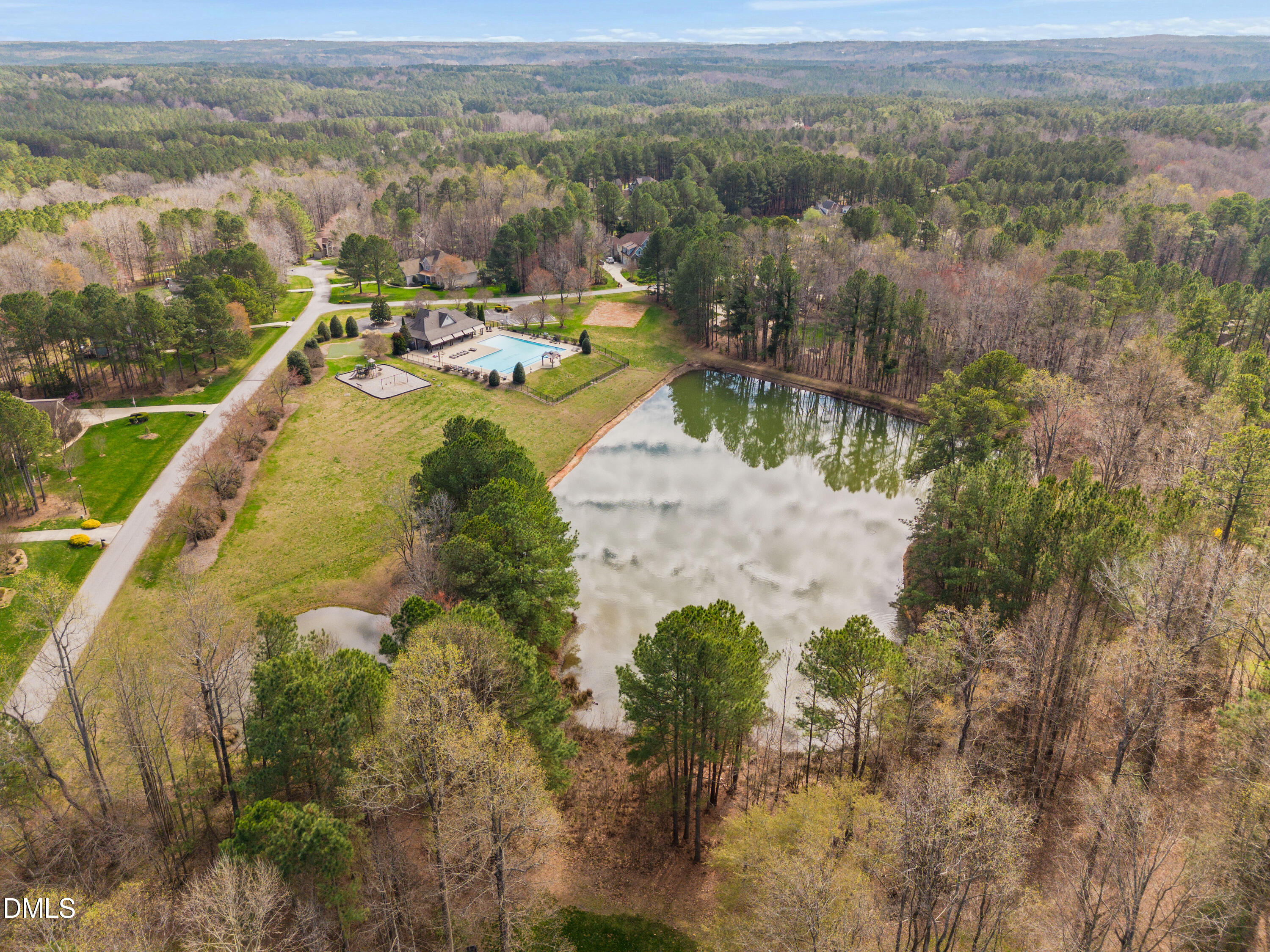 691 Hawthorne Place Creedmoor, NC 27522 - Photo 84 of 84 a view of a lake with a mountain in the background