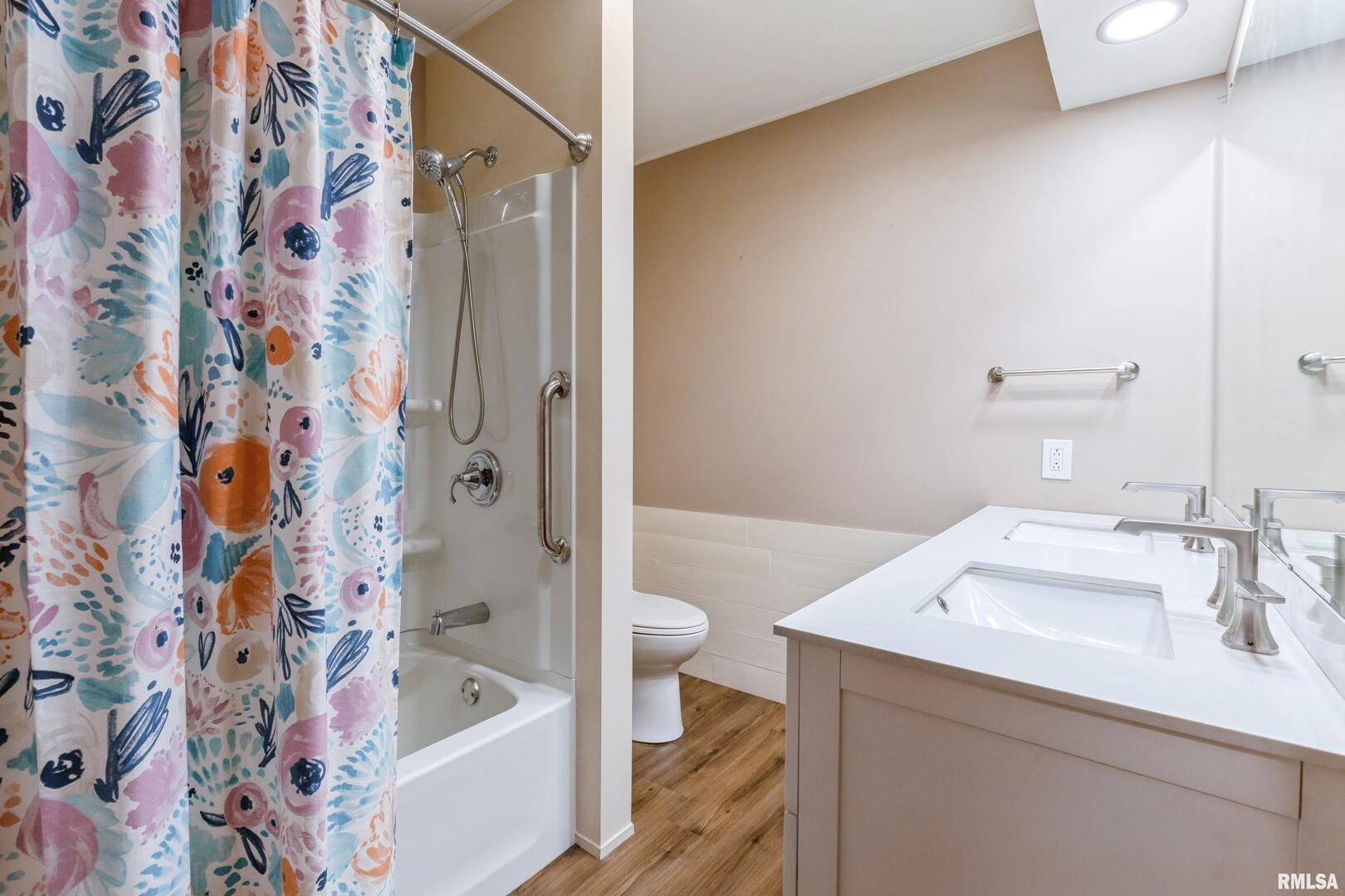 1136 Bobetta Court Clinton, IA 52732 - Photo 24 of 28 a bathroom with a sink a toilet and shower