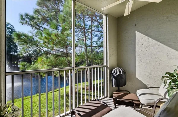 a view of a balcony with chair and a potted plant