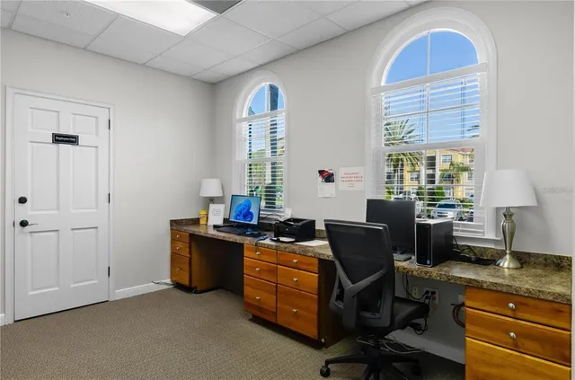 a view of workspace with furniture and window