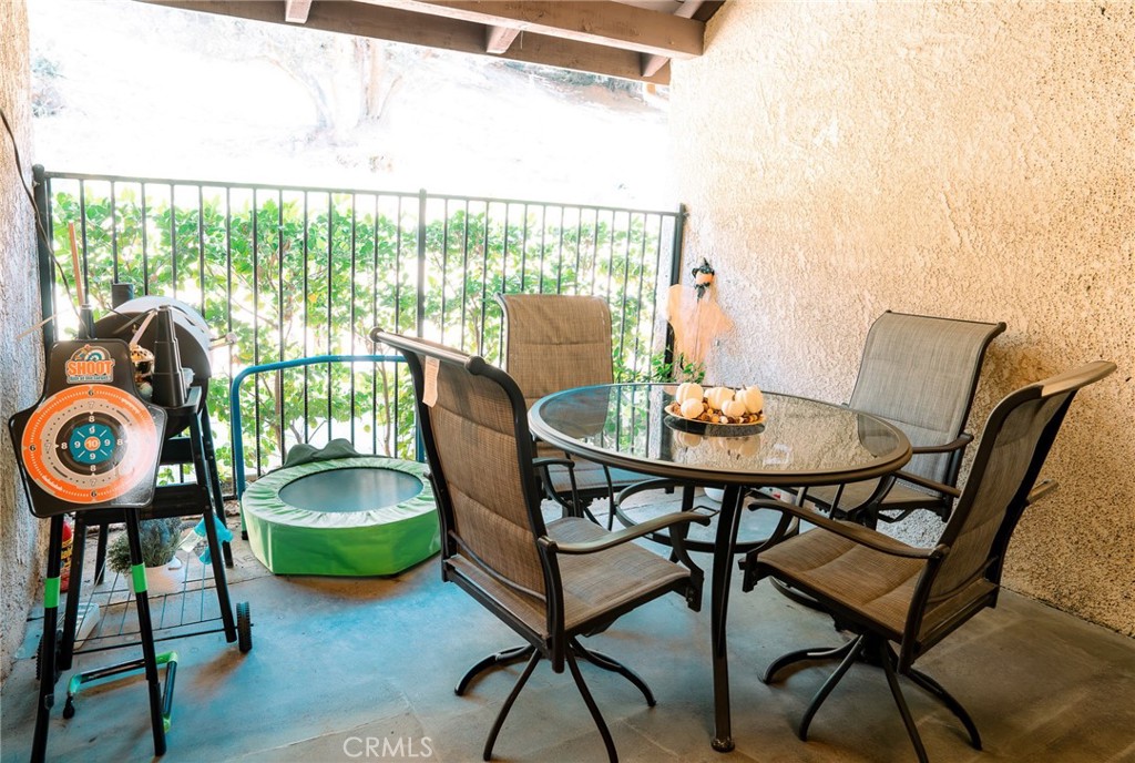 9759 Vía Roma Burbank, CA 91504 - Photo 12 of 29 a view of a dining room with furniture window and wooden floor