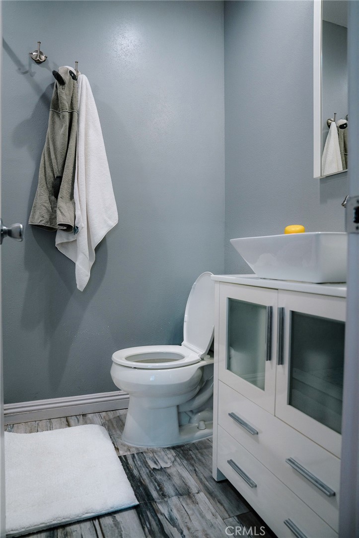9759 Vía Roma Burbank, CA 91504 - Photo 15 of 29 a bathroom with a toilet and a sink