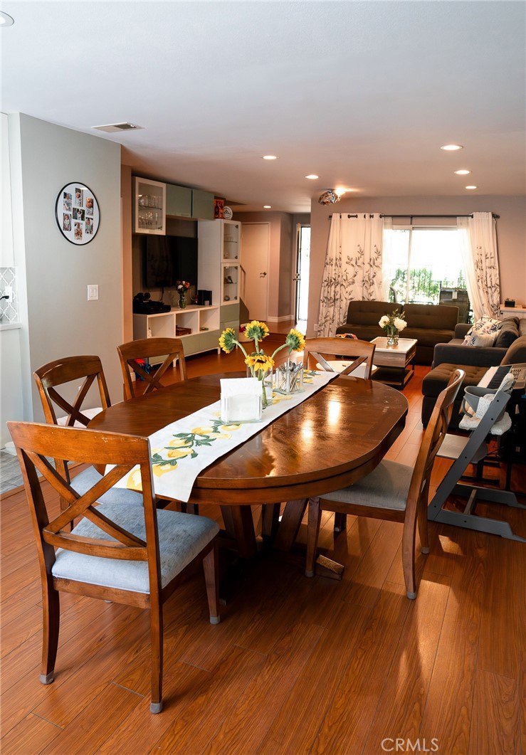 9759 Vía Roma Burbank, CA 91504 - Photo 4 of 29 a view of a dining room with furniture and wooden floor
