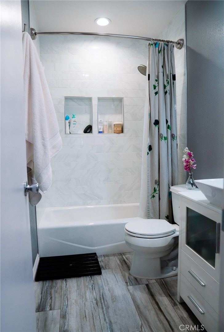 9759 Vía Roma Burbank, CA 91504 - Photo 8 of 29 a bathroom with a sink toilet and shower
