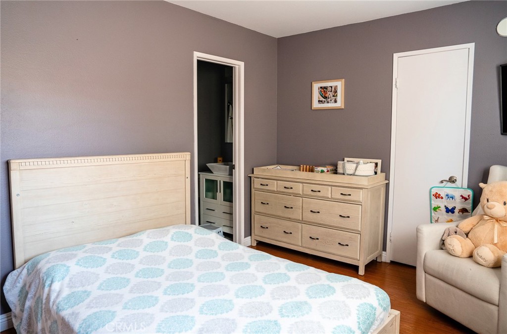 9759 Vía Roma Burbank, CA 91504 - Photo 10 of 29 a bedroom with a bed and a dresser