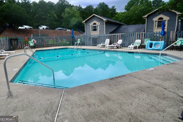 a aerial view of a house with swimming pool and porch