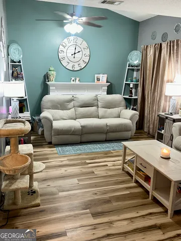 a living room with furniture and a table