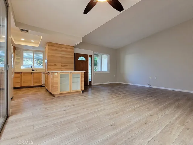 a view of a kitchen with a sink and cabinets