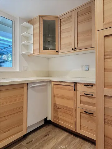 a view of a swimming pool with a patio and a yard