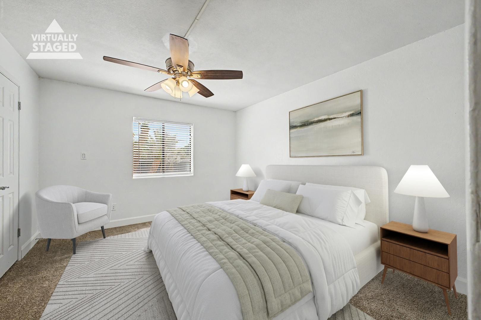 3825 East Camelback Road, Unit 144 Phoenix, AZ 85018 - Photo 11 of 35 a bedroom with a bed and a chandelier