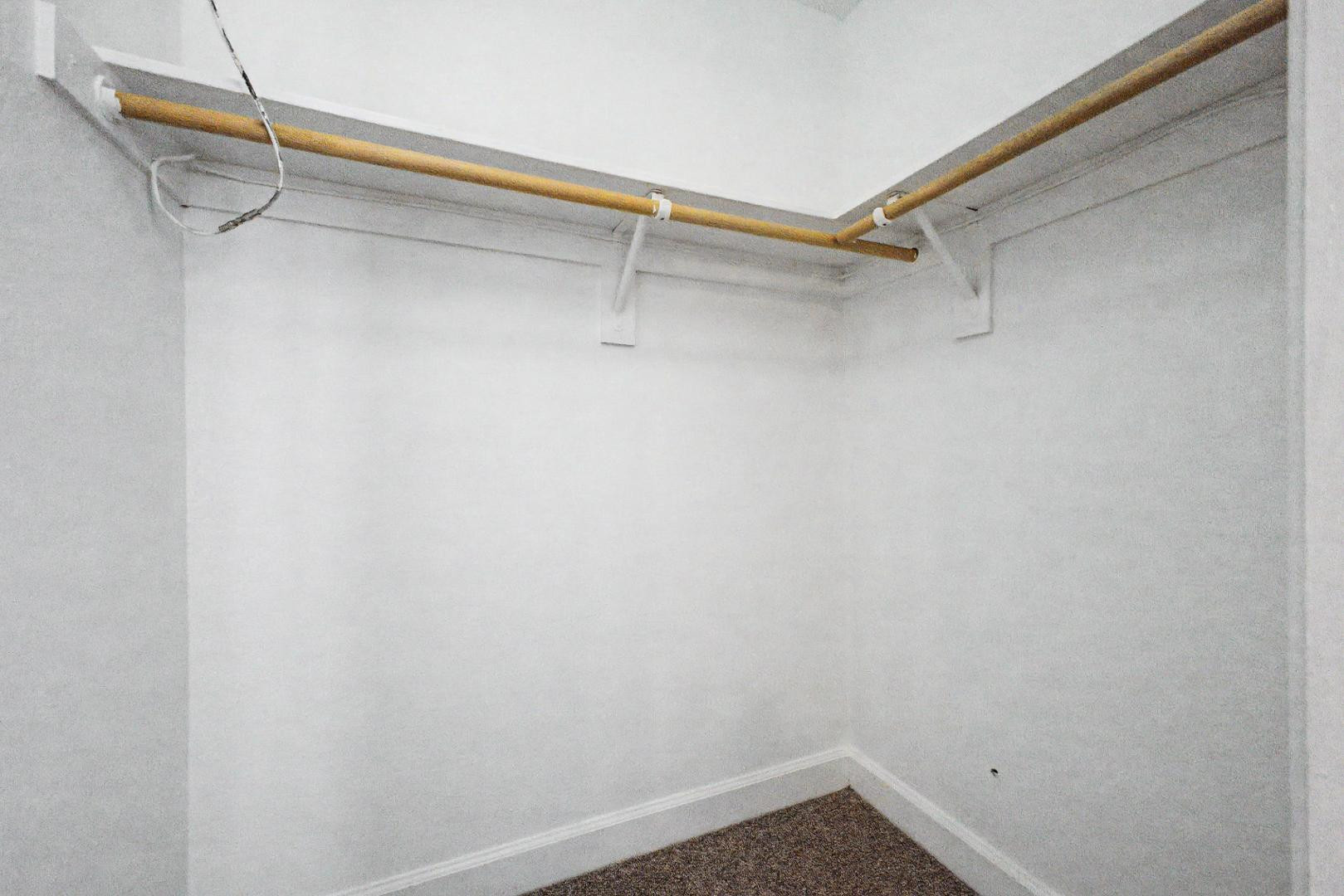 3825 East Camelback Road, Unit 144 Phoenix, AZ 85018 - Photo 16 of 35 a view of a room with racks on the wall